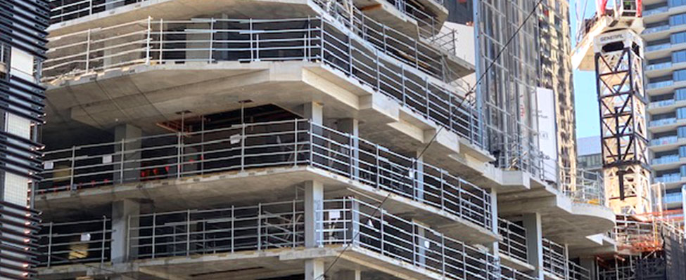 Contruction site with temporary handrail installation
